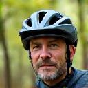 Portrait of a rugged man in mountain biking helmet.